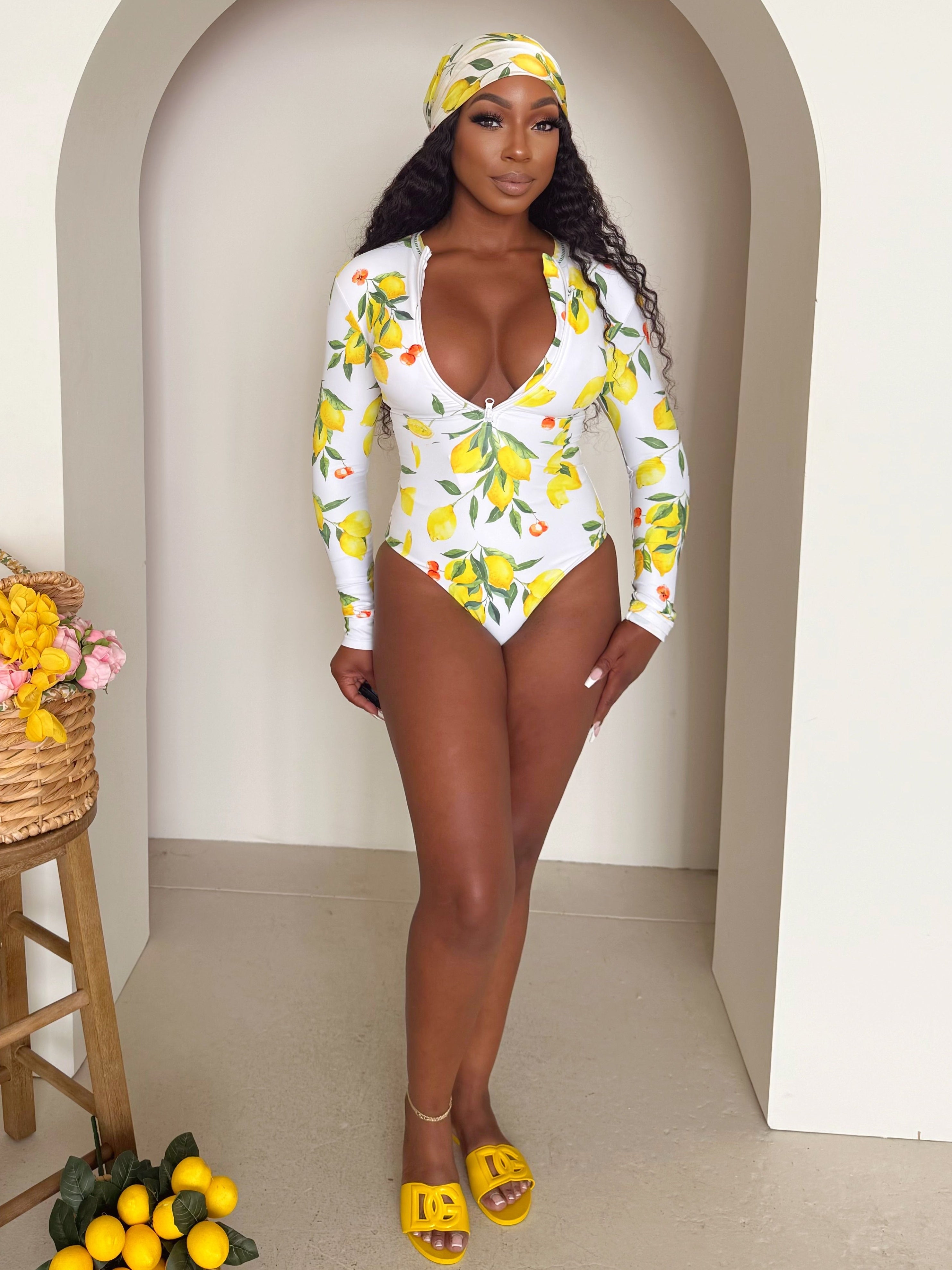 Sunkissed Citrus: A Head-Turning Lemon Print One-Piece for Resort Elegance with a Twist