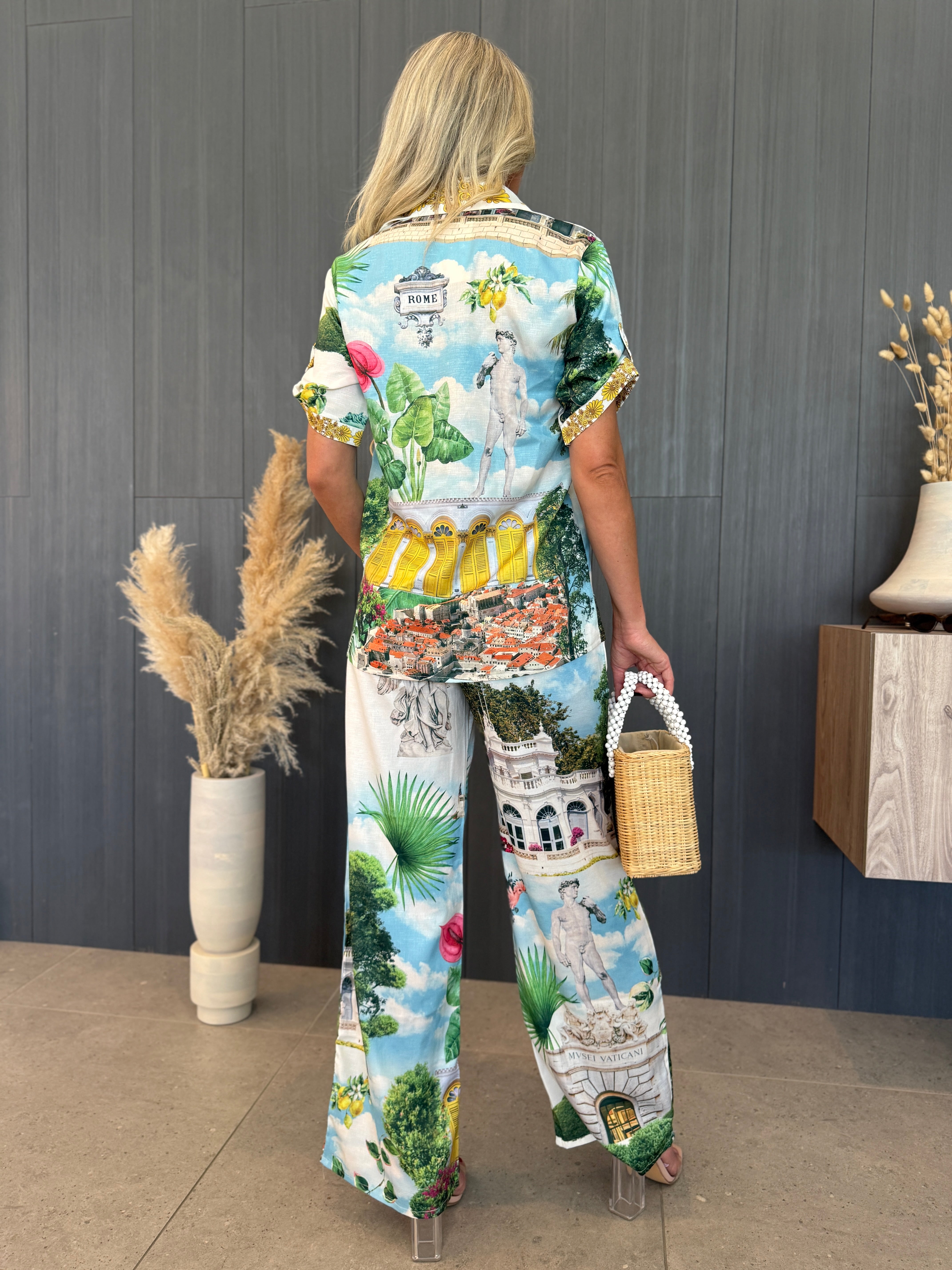 Travel-inspired shirt and pants vacation outfit