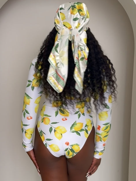 Sunkissed Citrus: A Head-Turning Lemon Print One-Piece for Resort Elegance with a Twist